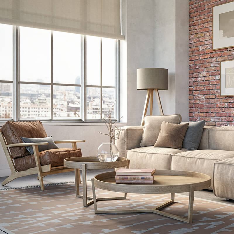 Bohemian living room interior with beige colored furniture and wooden elements and brick wall